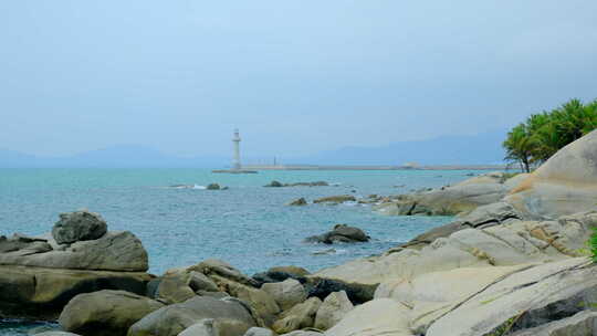 风平浪静大海礁石海边海浪海景 灯塔