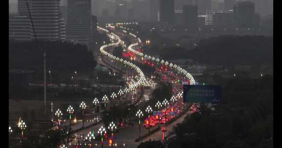 武汉傍晚灯光斑斓的城市公路航拍