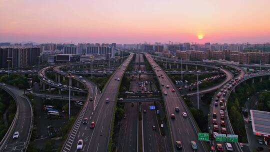 航拍夕阳下杭州城区高架立交桥