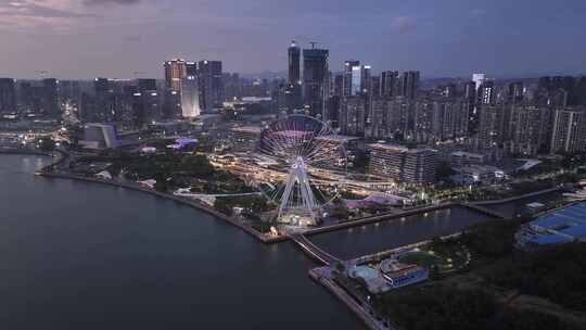 欢乐港湾摩天轮城市晚霞夜景