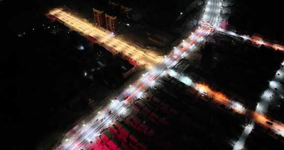 航拍雪后城市十字路口夜景