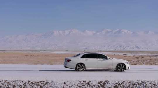 汽车行驶在冰天雪地航拍雪景公路视频素材模板下载