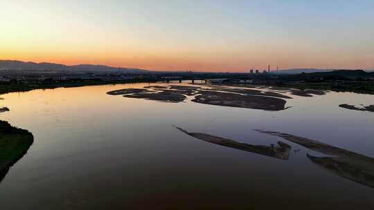航拍宁夏石嘴山夕阳下的黄河湿地石嘴子公园