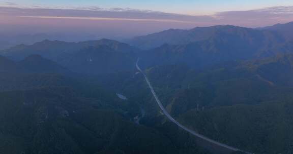 航拍大山里高速公路 山顶上电塔