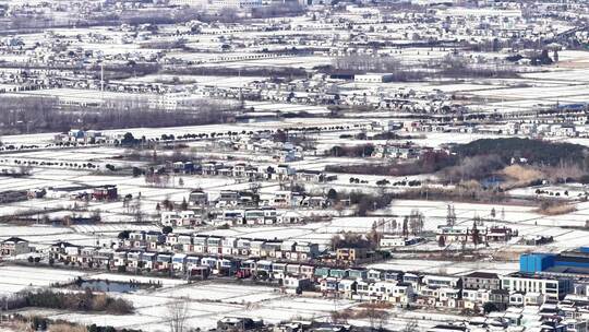 航拍乡镇雪景学校建筑田地大桥别墅河流房屋