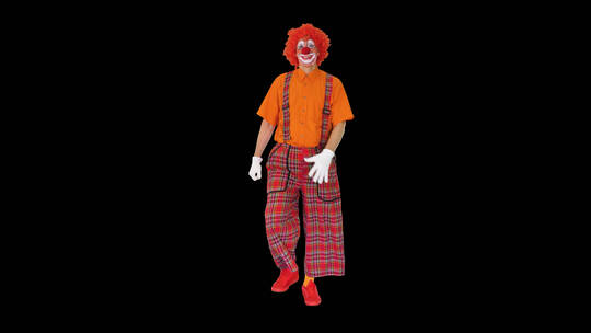 黑色背景前滑稽的红头发小丑视频素材模板下载