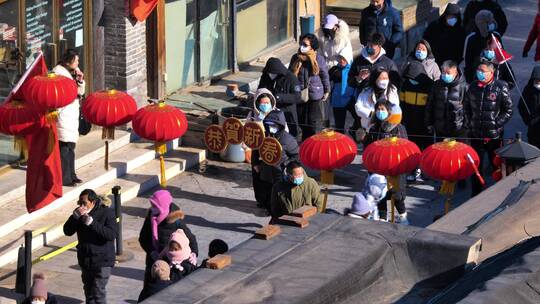 春节期间北京胡同的游客视频素材模板下载