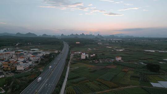 广西高速公路黄昏时沿途村庄视频素材模板下载