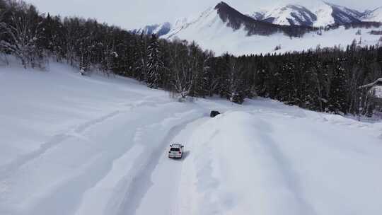 航拍冬季新疆阿勒泰禾木雪景雪山森林村落