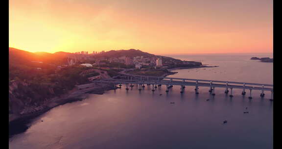 大连航拍海边跨海湾大桥唯美岩壁大海夕阳