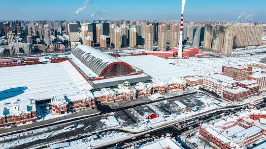 辽宁沈阳站航拍冬季城市雪景大范围延时