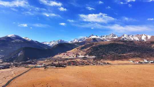 航拍四川甘孜扎西持林寺庙雪山风光