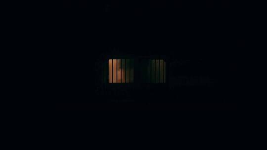 在黑夜里一个关闭的窗户里亮着视频素材模板下载