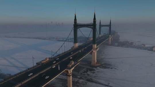 哈尔滨阳明滩大桥雪景航拍日出