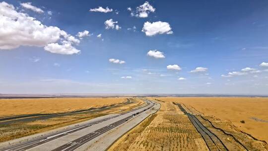 高清航拍甘肃沙漠公路蓝天白云自然风光