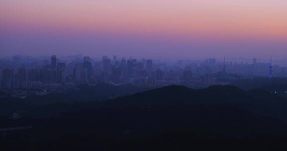 夕阳黄昏时广州白云山俯瞰城市建筑群
