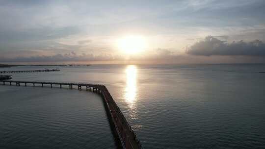 北海海上栈道航拍海边日落晚霞