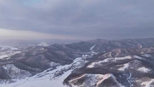 航拍寒冬山区山林雪景暮色