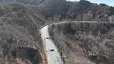 航拍山间蜿蜒公路高清在线视频素材下载