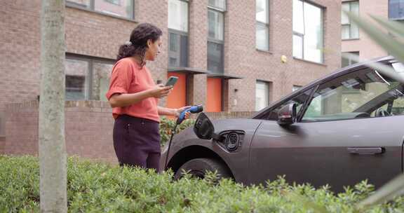 女人，充电，电动车，建筑