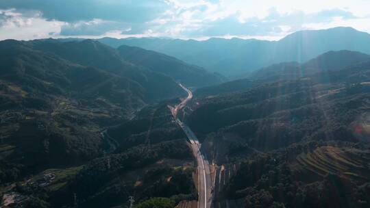 高速公路建设视频云南山区高速公路逆光远景视频素材模板下载