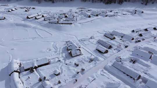 航拍新疆禾木雪景森林雪地小木屋禾木桥雪山