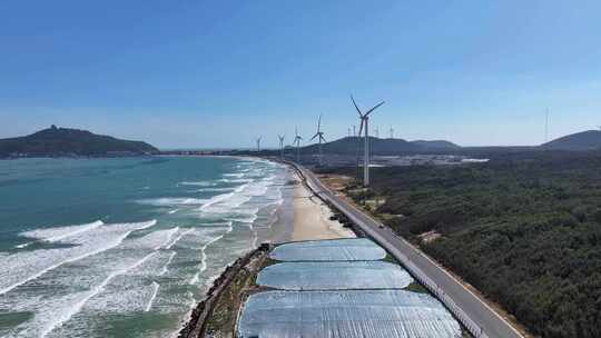 航拍福建漳州东山岛海岸线新能源风力发电
