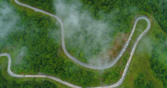 四川九顶山蜿蜒盘山路高角度航拍云雾缭绕