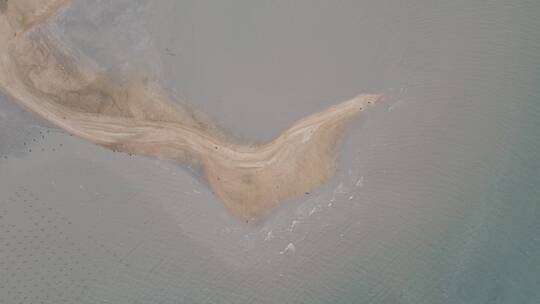 俯拍海上月牙湾沙滩视频素材模板下载