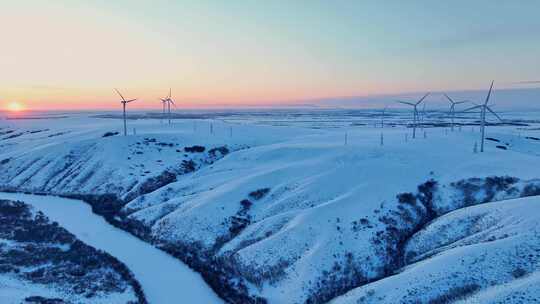 航拍呼伦贝尔冬季落日雪原风力发电清洁能源