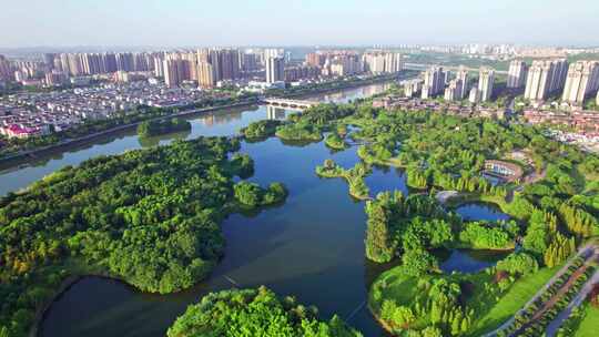 四川眉山东坡城市湿地公园城市风光日落航拍