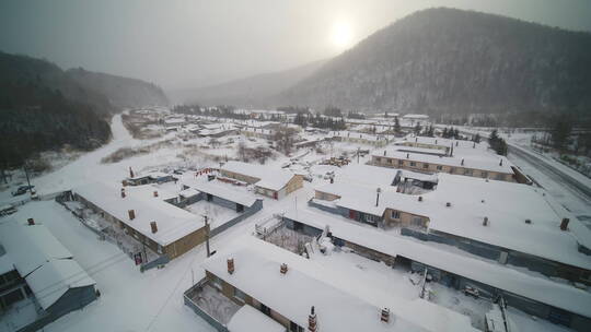 航拍东北山区冬天村庄冰雪