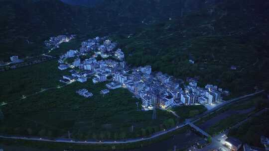 航拍广东茂名信宜钱排镇云开山下城镇夜景