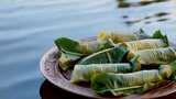 水边盘子里的粽叶包裹食物高清在线视频素材下载
