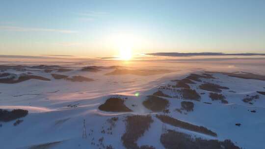 航拍雪域雪原夕阳