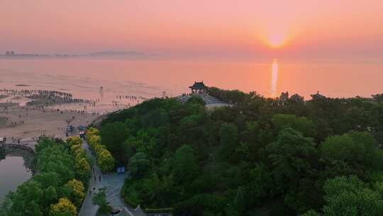 航拍北戴河鸽子窝湿地公园海上日出