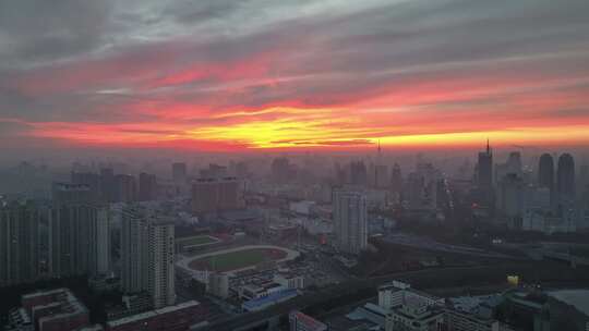 航拍黑龙江省哈尔滨市城市天际线火烧云景观