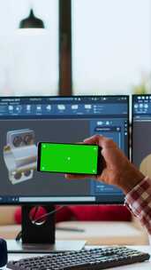 垂直视频男性自由设计师使用绿屏远程制作3