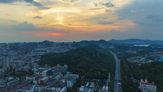 航拍日落晚霞时刻深圳宝安全景和京港澳车流