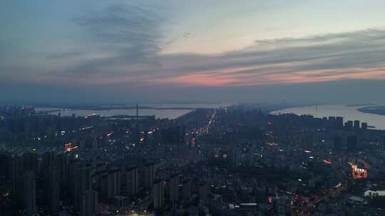 晚霞中的江西九江城市夜景航拍