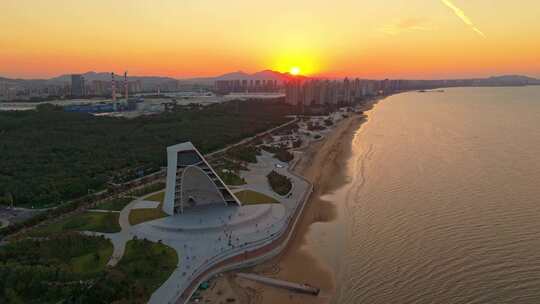 航拍落日晚霞下的烟台时光塔建筑风光全景