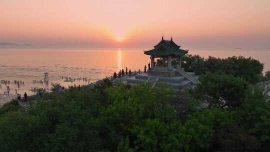 航拍北戴河鸽子窝湿地公园海上日出