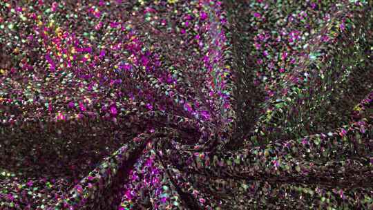 炫目亮片的漩涡织物闪闪发光，色彩鲜艳，为