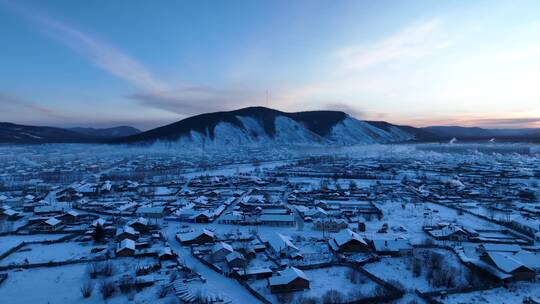 航拍寒冬黎明森林小镇雪景