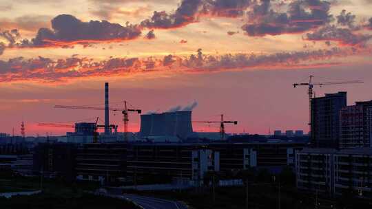 航拍火力发电厂夕阳火烧云楼层建筑施工地