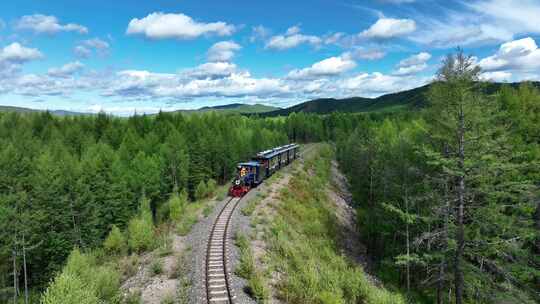 航拍行驶在大兴安岭的森林小火车