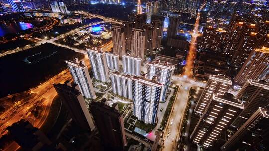 航拍夜晚新建楼盘高层住宅和景观绿化夜景