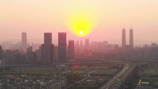 航拍夕阳杭州萧山钱江世纪城机场城市大道