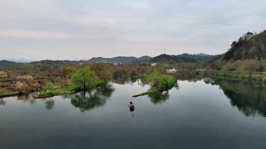 油菜花月亮湾春色渔夫撒网