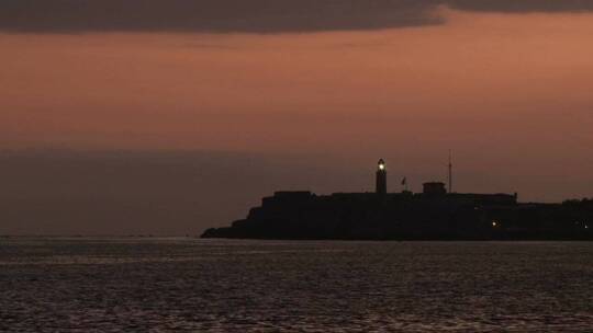 日落海边的灯塔航拍视频素材模板下载